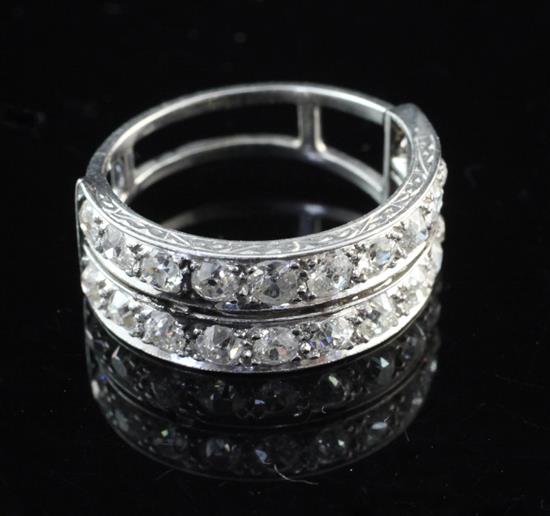 A 1930s/1940s platinum and diamond double band half eternity ring, size O.